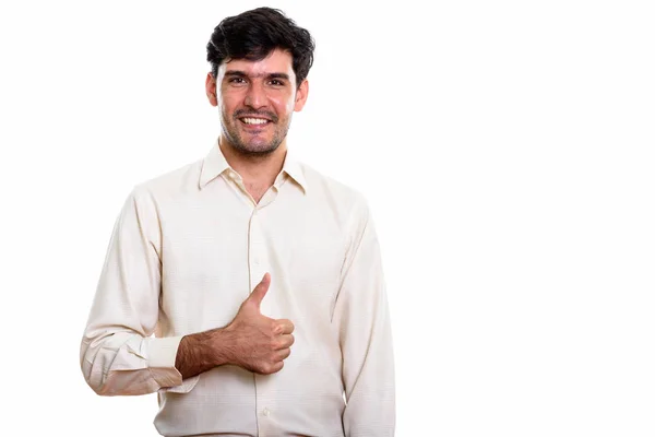 Estúdio Tiro Jovem Feliz Empresário Persa Sorrindo Enquanto Polegar Para — Fotografia de Stock