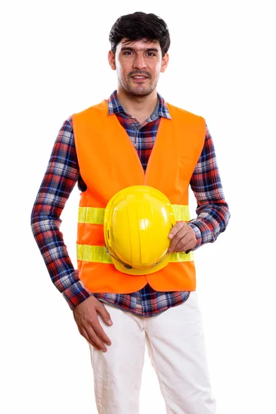 Estúdio Tiro Jovem Homem Persa Trabalhador Construção Enquanto Segurando Capacete — Fotografia de Stock