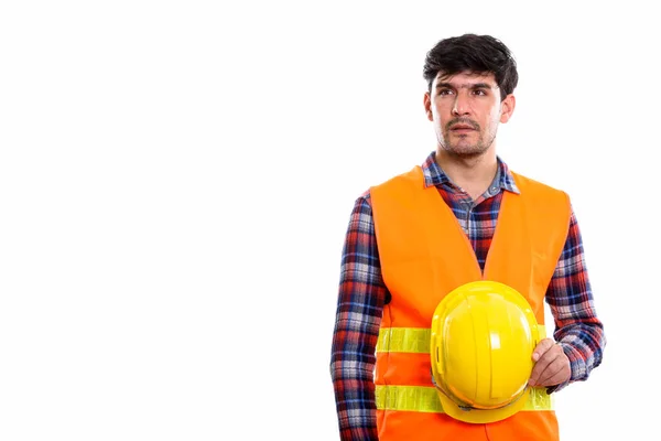 Ung Persisk Man Byggnadsarbetare Som Håller Säkerhetshjälm Samtidigt Tänka — Stockfoto