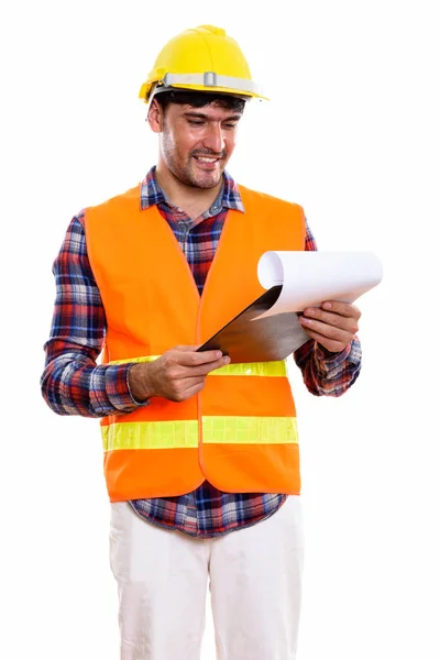 Jong Gelukkig Perzische Man Bouwvakker Glimlachen Tijdens Het Lezen Klembord — Stockfoto