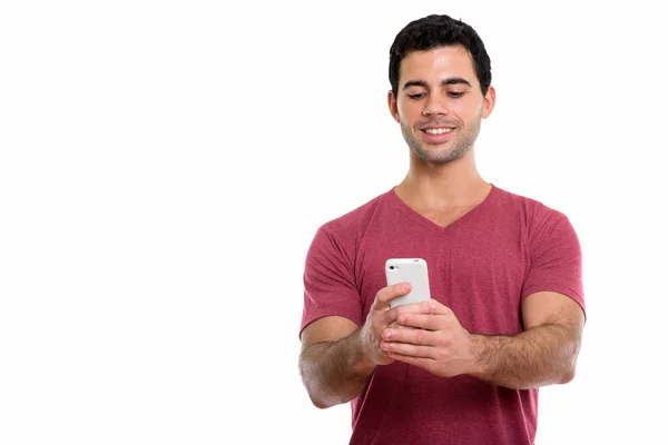 Studio Shot Young Happy Hispanic Man Smiling While Using Mobile — Stock Photo, Image