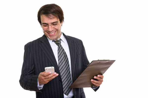 Young Happy Persian Businessman Smiling Using Mobile Phone While Holding — Stock Photo, Image