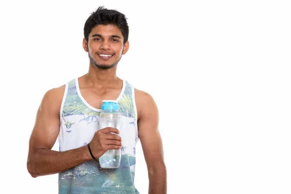 Studioaufnahme Eines Jungen Glücklichen Indischen Mannes Der Lächelt Während Eine — Stockfoto