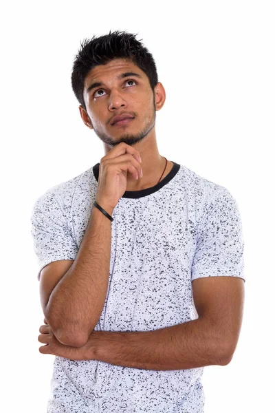 Estúdio Tiro Jovem Bonito Indiano Homem Pensando Enquanto Olha Para — Fotografia de Stock