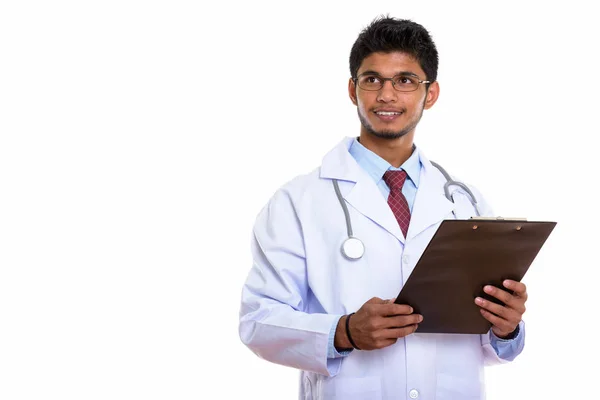 Studio Shot Young Happy Indian Man Doctor Smiling Holding Clipboard — Stock Photo, Image