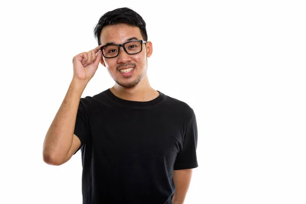 Estudio Disparo Joven Feliz Asiático Hombre Sonriendo Mientras Sostiene Las —  Fotos de Stock