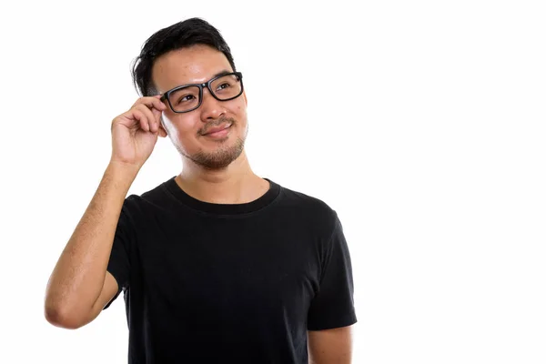 Estudio Disparo Joven Asiático Hombre Sosteniendo Gafas Mientras Pensaba —  Fotos de Stock