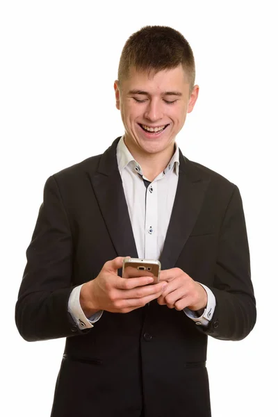 Studioaufnahme Eines Glücklichen Geschäftsmannes Der Lächelt Und Sein Handy Benutzt — Stockfoto