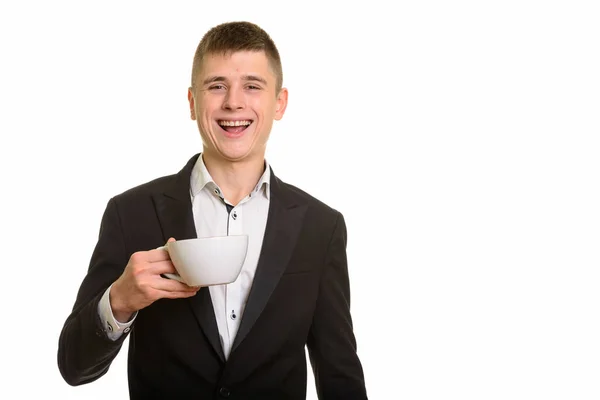 Studioaufnahme Eines Glücklichen Geschäftsmannes Der Lächelnd Eine Kaffeetasse Hält — Stockfoto