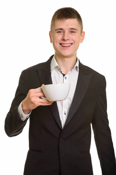 Estúdio Tiro Jovem Empresário Feliz Sorrindo Enquanto Segurando Xícara Café — Fotografia de Stock