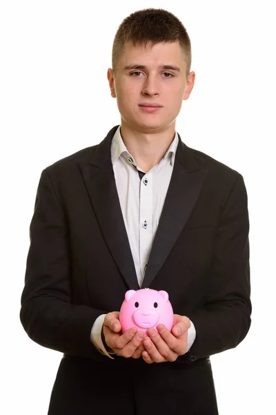 Studioaufnahme Eines Jungen Geschäftsmannes Mit Sparschwein — Stockfoto