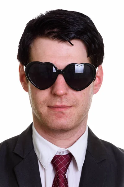 Arc, jóképű üzletember, szív alakú napszemüveget visel — Stock Fotó