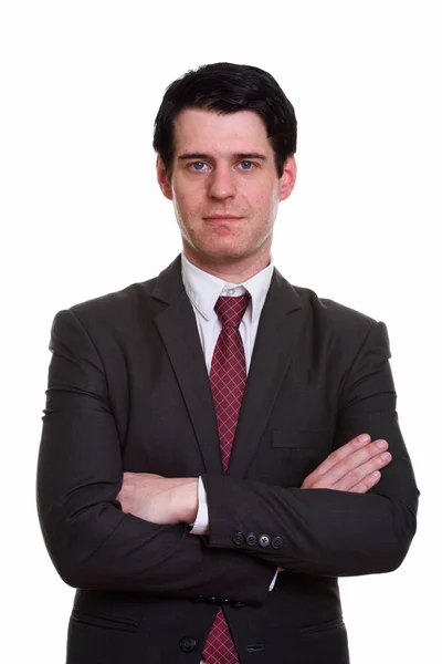 Studio shot of handsome businessman with arms crossed — Stock Photo, Image