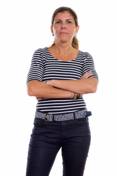 Studio shot of mature beautiful woman standing with arms crossed — Stock Photo, Image