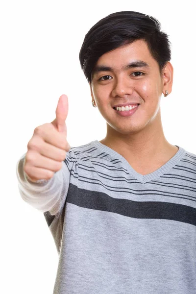 Close up de feliz asiático homem sorrindo e dando o polegar para cima — Fotografia de Stock