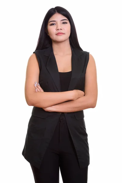 Studio shot of young Asian woman with arms crossed — Stock Photo, Image