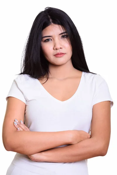 Studio shot of young Asian woman with arms crossed — Stock Photo, Image