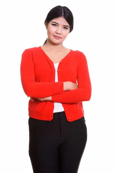 Studio shot of young Asian woman with arms crossed — Stock Photo, Image