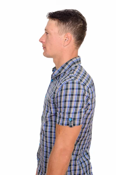 Side view of young handsome Caucasian man isolated against white — Stock Photo, Image