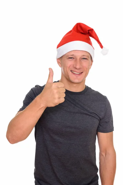 Студийный снимок молодого красивого белого мужчины, готового к Рождеству — стоковое фото