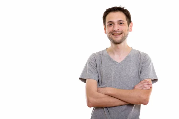 Studio colpo di felice giovane uomo sorridente con le braccia incrociate — Foto Stock