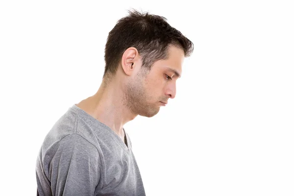 Profile view of sad young man looking down — Stock Photo, Image
