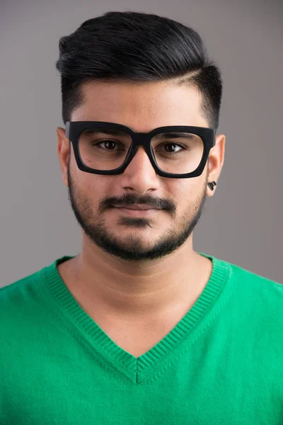 Face of young handsome Indian man