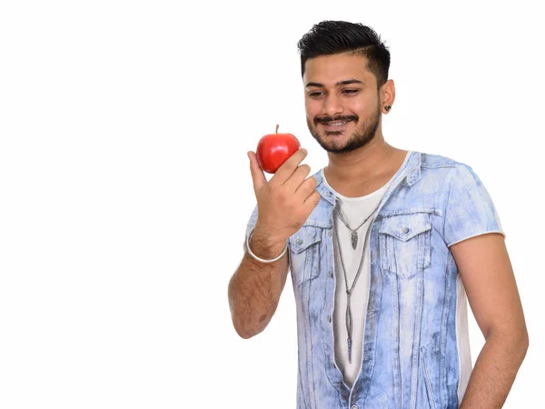 Νέοι ευτυχισμένος άνθρωπος ινδική κρατώντας κόκκινο μήλο — Φωτογραφία Αρχείου