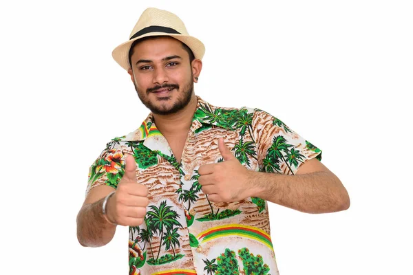 Young happy handsome Indian man ready for vacation giving thumbs — Stock Photo, Image