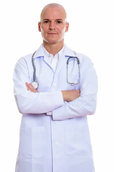 Studio shot of young handsome bald man doctor with arms crossed — Stock Photo, Image