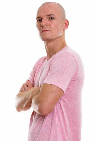 Studio shot of young handsome bald man with arms crossed — Stock Photo, Image