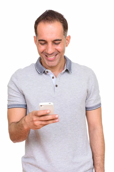 Mature happy Persian man using mobile phone — Stock Photo, Image