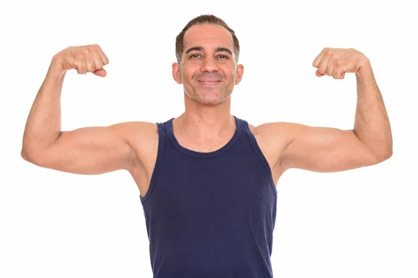 Maduro feliz persa hombre flexionando ambos brazos preparándose para el gimnasio — Foto de Stock