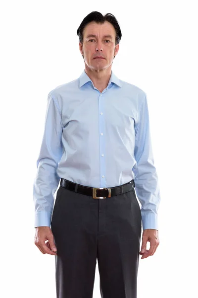 Studio shot of mature handsome businessman standing — Stock Photo, Image