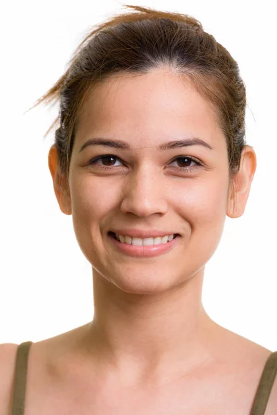 Rostro de feliz joven hermosa mujer sonriendo con el pelo atado — Foto de Stock