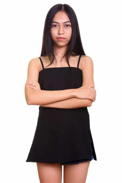 Studio shot de jeune asiatique adolescent fille debout avec bras croisés — Photo