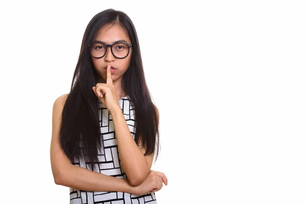 Молоді азіатські підлітка ботанік дівчина пальцем на губах — стокове фото
