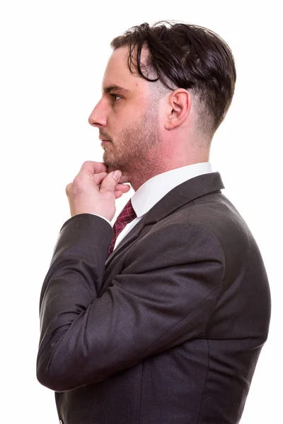 Profile view of young businessman thinking — Stock Photo, Image