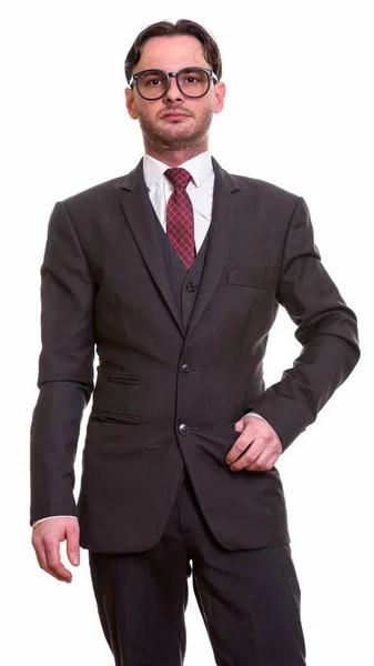 Studio shot of young businessman standing — Stock Photo, Image