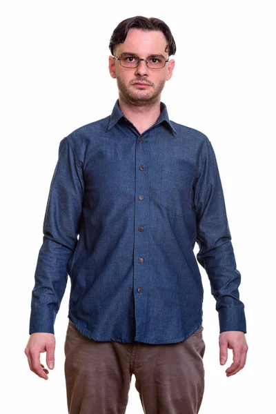 Studio shot of formal young man standing wearing eyeglasses — Stock Photo, Image