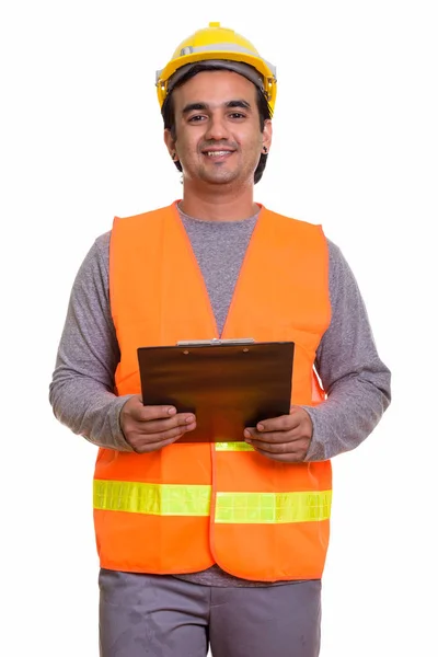 Feliz homem persa trabalhador da construção sorrindo enquanto segurando clip — Fotografia de Stock