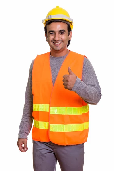 Feliz homem persa trabalhador da construção sorrindo enquanto dá polegar — Fotografia de Stock