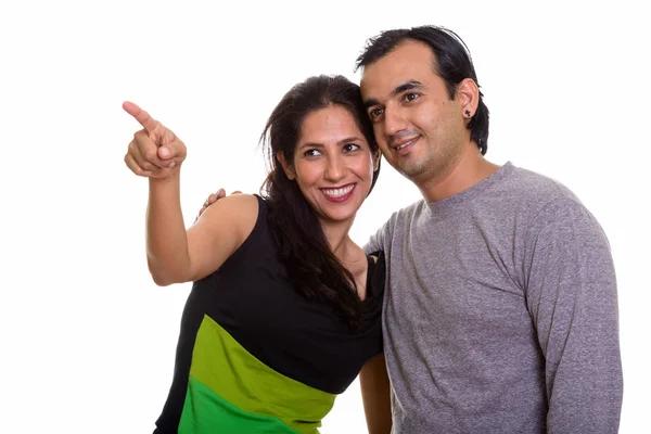 Happy Persian couple smiling and looking at distance together wi — Stock Photo, Image