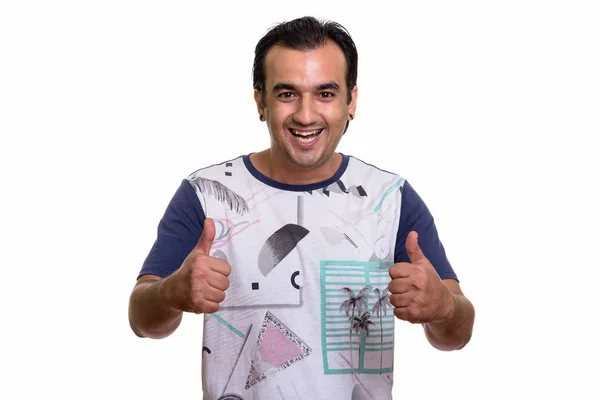 Studio shot of happy Persian man smiling while giving thumbs up — Stock Photo, Image