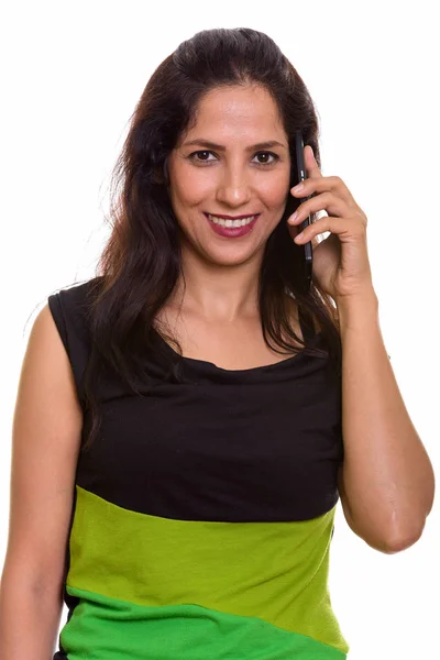 Close up of happy Persian woman smiling while talking on mobile — Stock Photo, Image