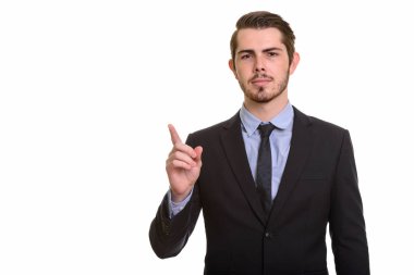 Genç yakışıklı beyaz iş adamı işaret parmağı yukarıya