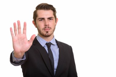 Genç yakışıklı beyaz işadamı stop el hareketi ile