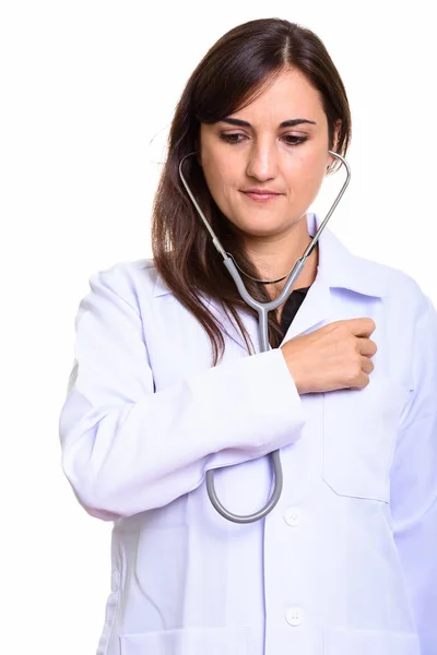 Close up of beautiful woman doctor using stethoscope on herself — Stock Photo, Image