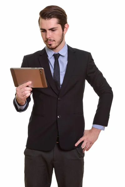 Young handsome Caucasian businessman holding digital tablet — Stock Photo, Image