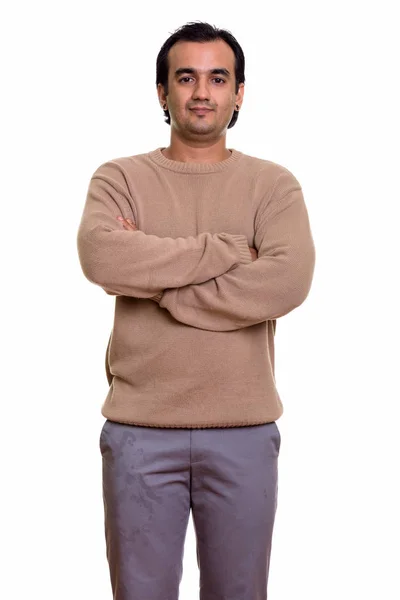 Studio shot of Persian man standing with arms crossed — Stock Photo, Image